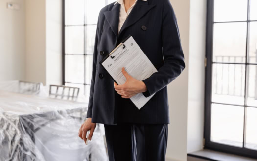 Photo by MART PRODUCTION: https://www.pexels.com/photo/person-in-black-blazer-holding-a-documents-7415041/